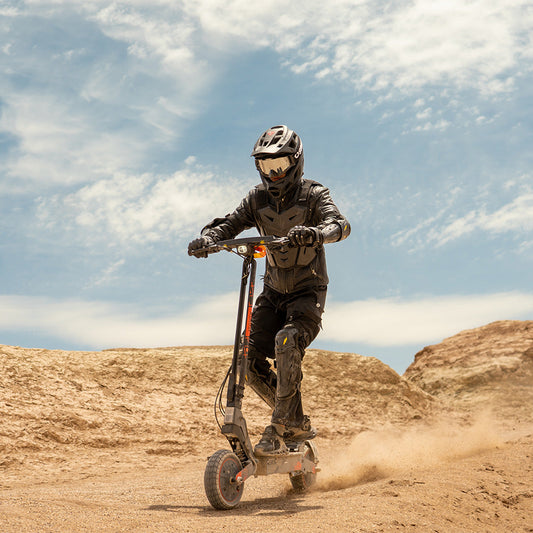 Kukirin G2 Ultra electric scooter riding in desert terrain for off-road performance