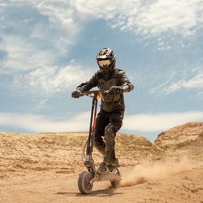 Kukirin G2 Ultra electric scooter riding in desert terrain for off-road performance